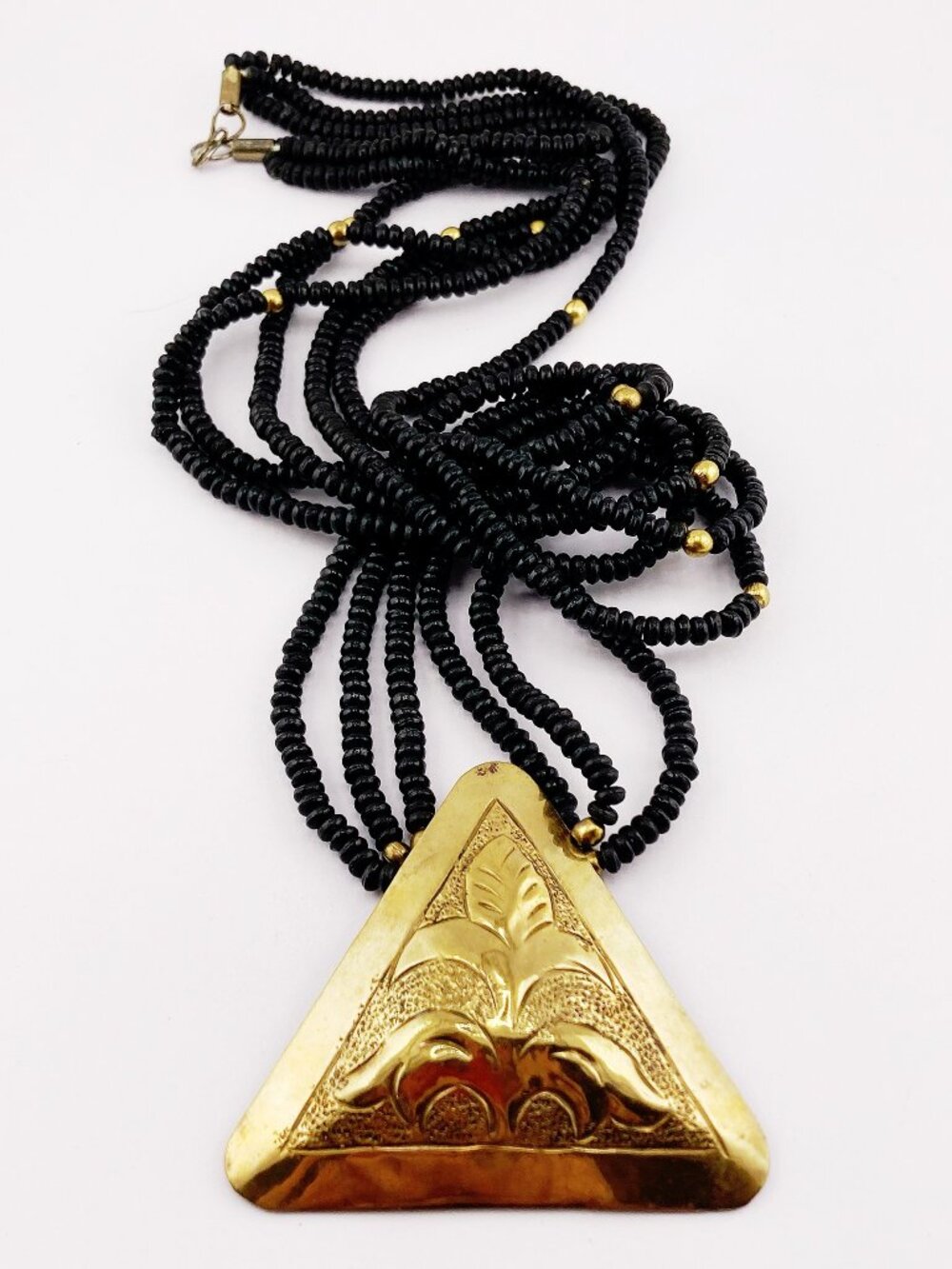 VINTAGE Long black wooden bead and etched aged brass triangle pendant necklace